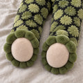 Close-up of the footed legs with cream soles and rounded turtle toes