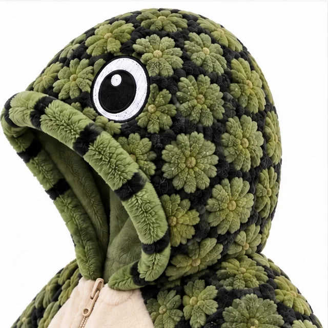 Side view of the hood showing one eye and the soft striped edge around the face