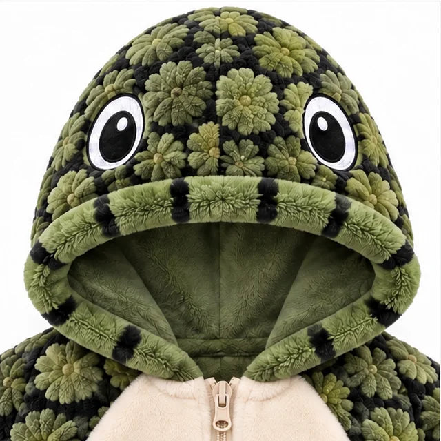 The Turtle hood from the front, with two big embroidered eyes and a striped rolled edge