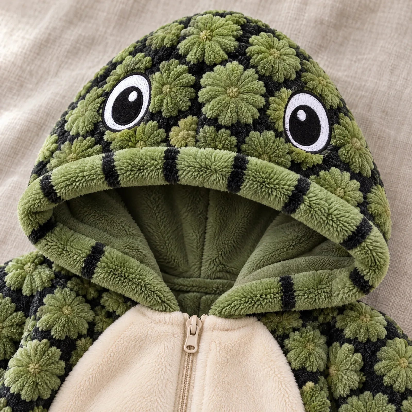 Close-up of the Turtle hood with embroidered eyes and striped edge